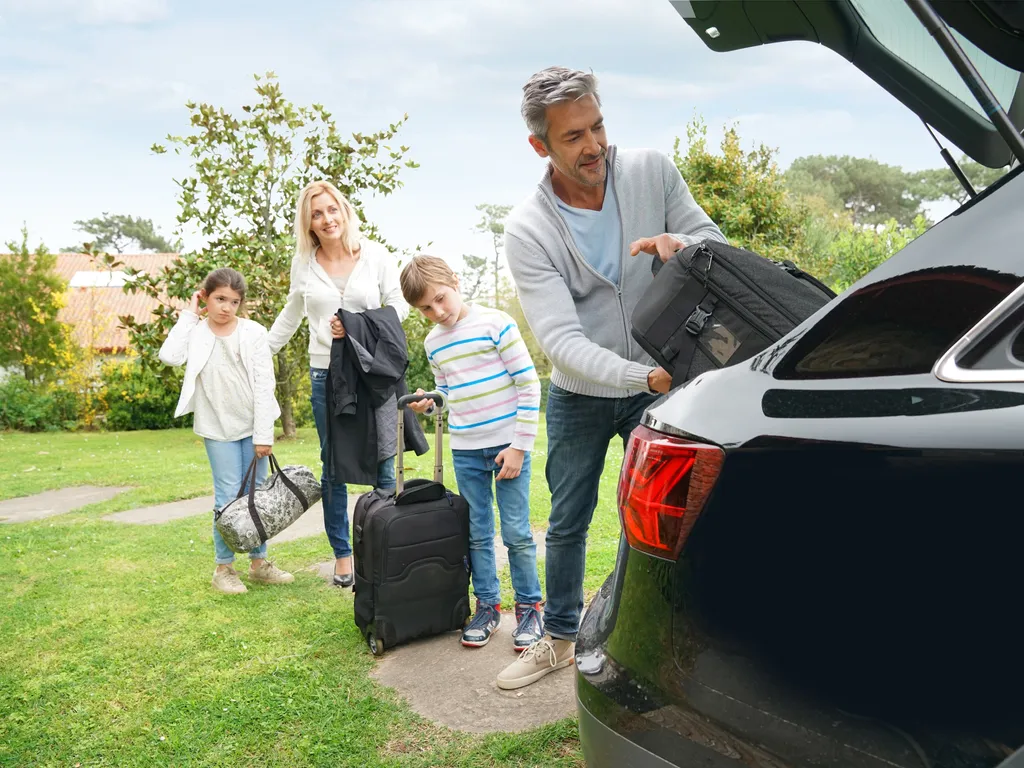 Family put suitcase in car