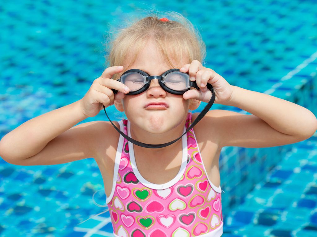 Funny girl in swimmingpool