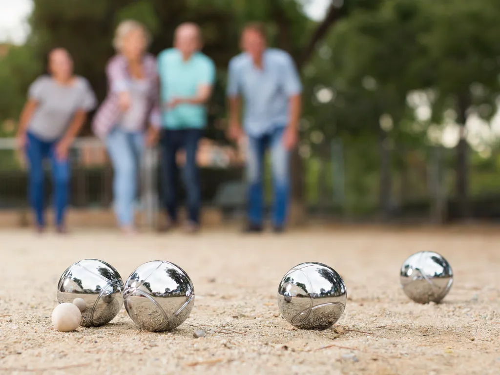 Group of people playing jeu de boules