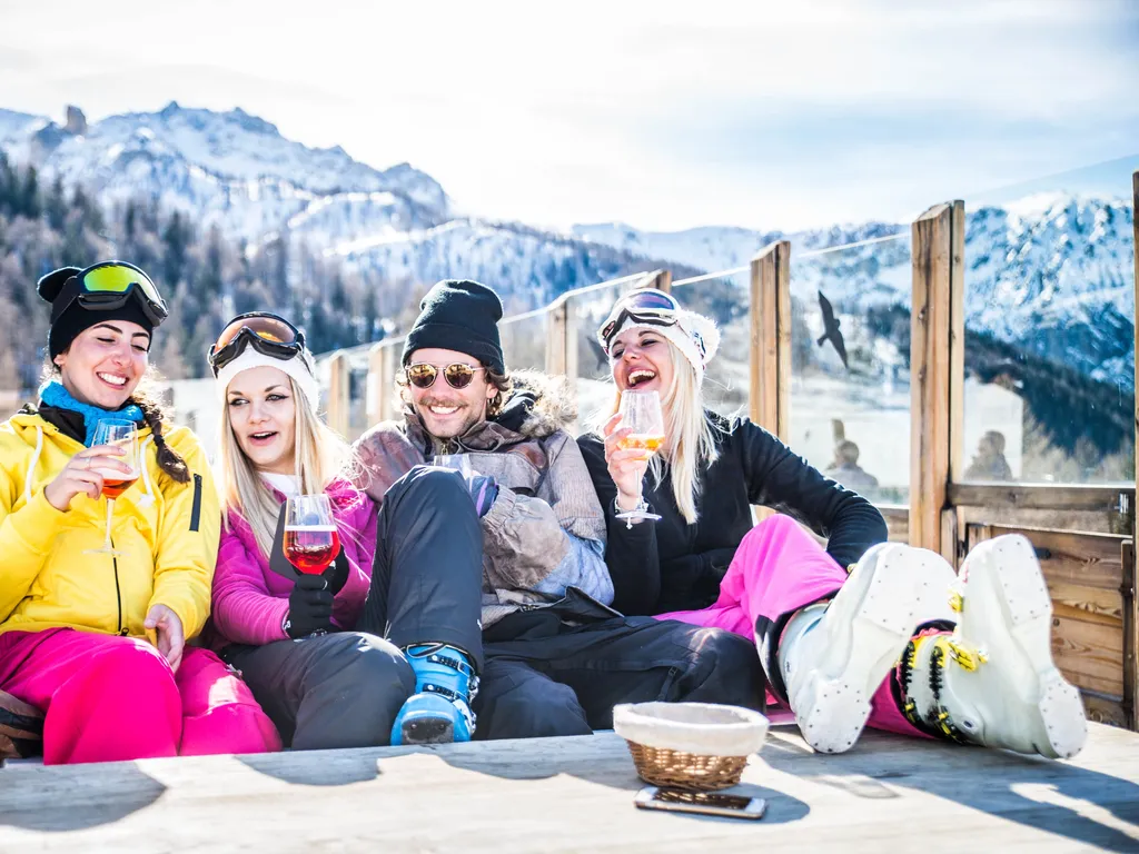 Group of friends having drinks apres ski