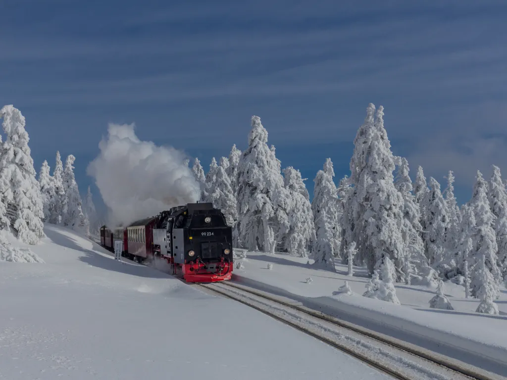 on the way in the winter landscape through the beautiful harz