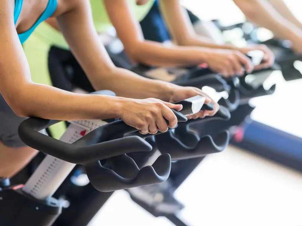 people in a spin class at the gym