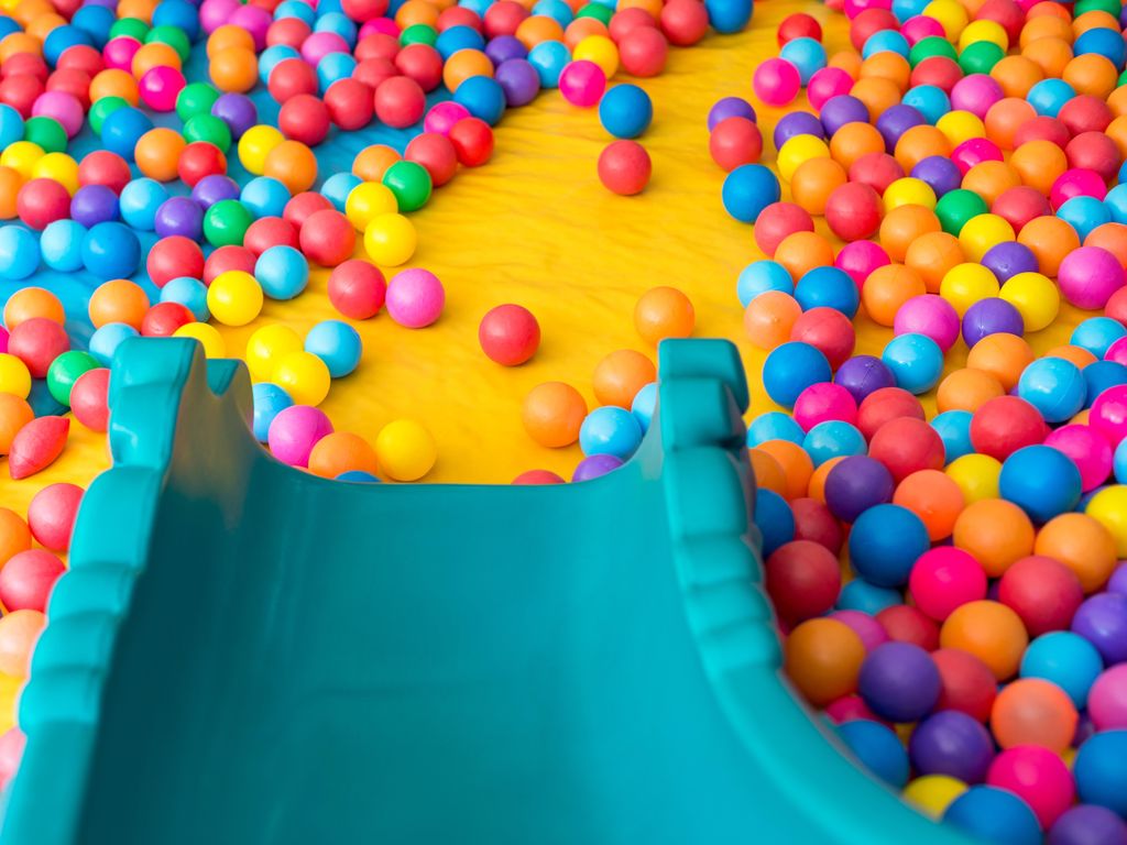 Playground slide and plastic balls