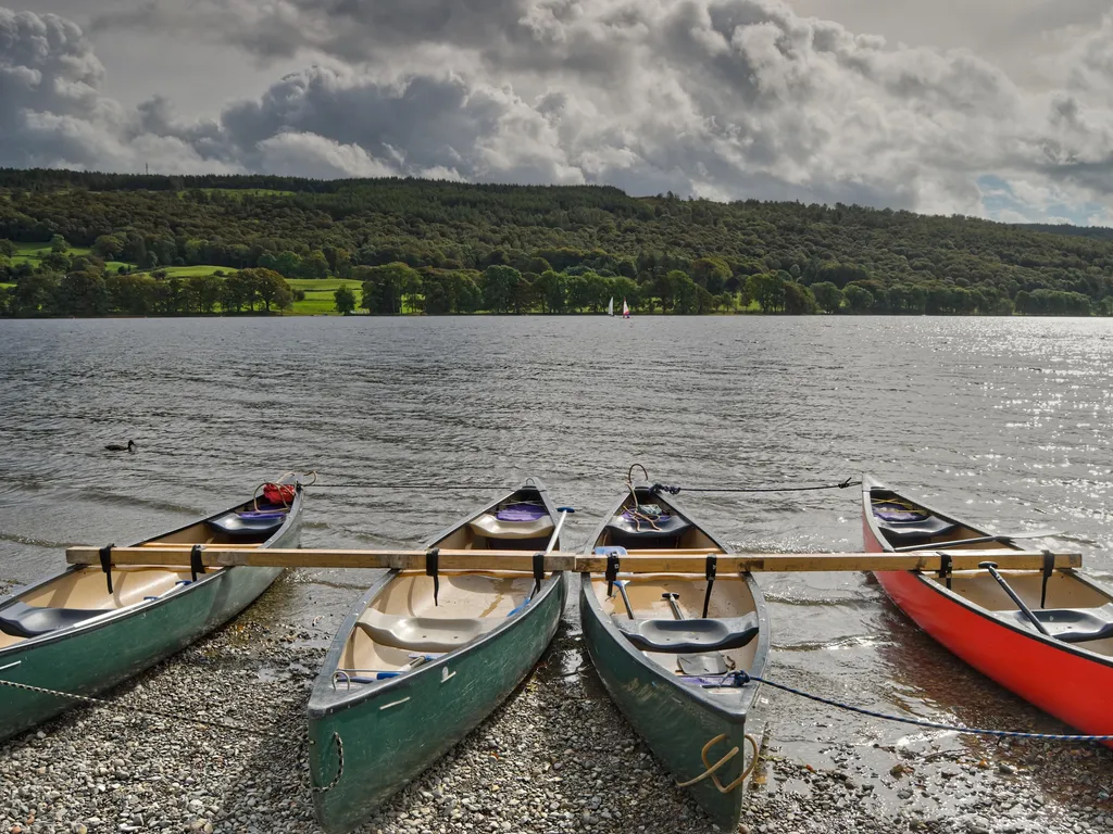 Canoes on the shore of Coniston Water in the English lake District