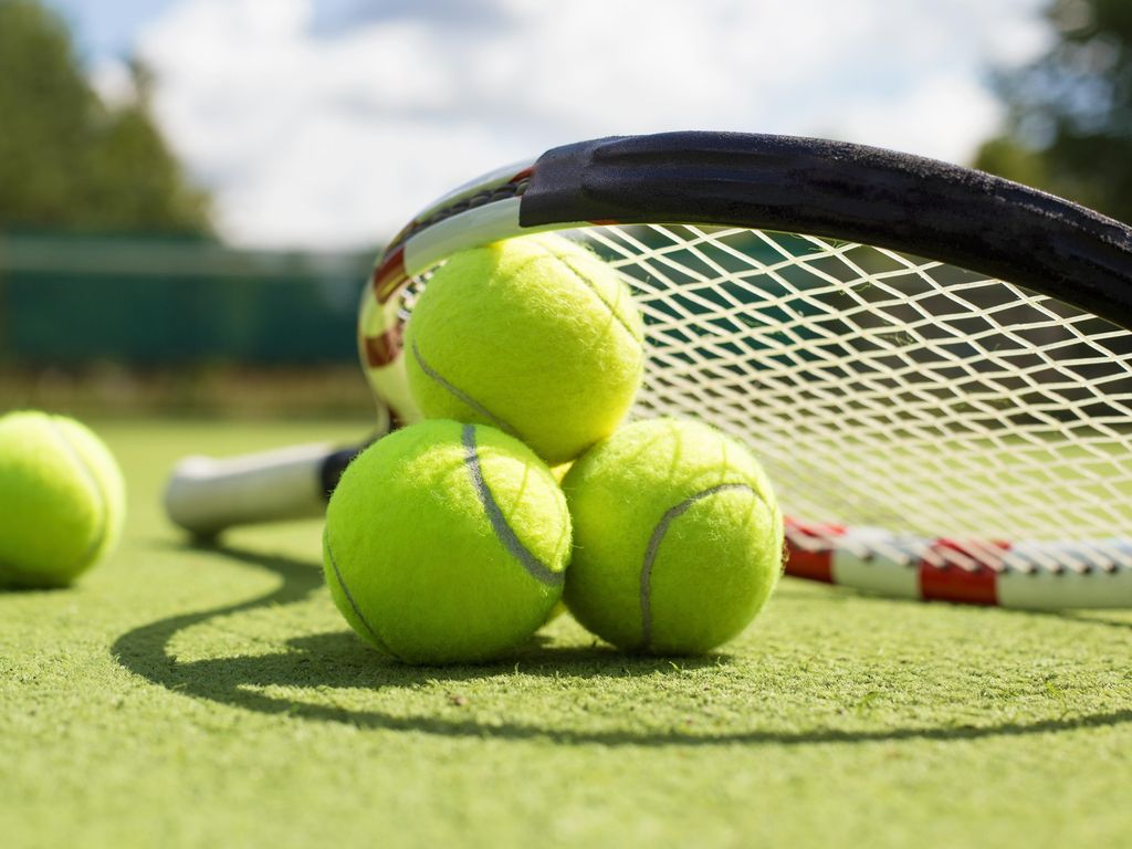 Tennis balls and racket