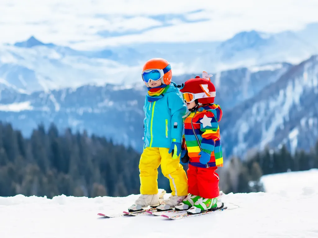Kids skiing in the mountains