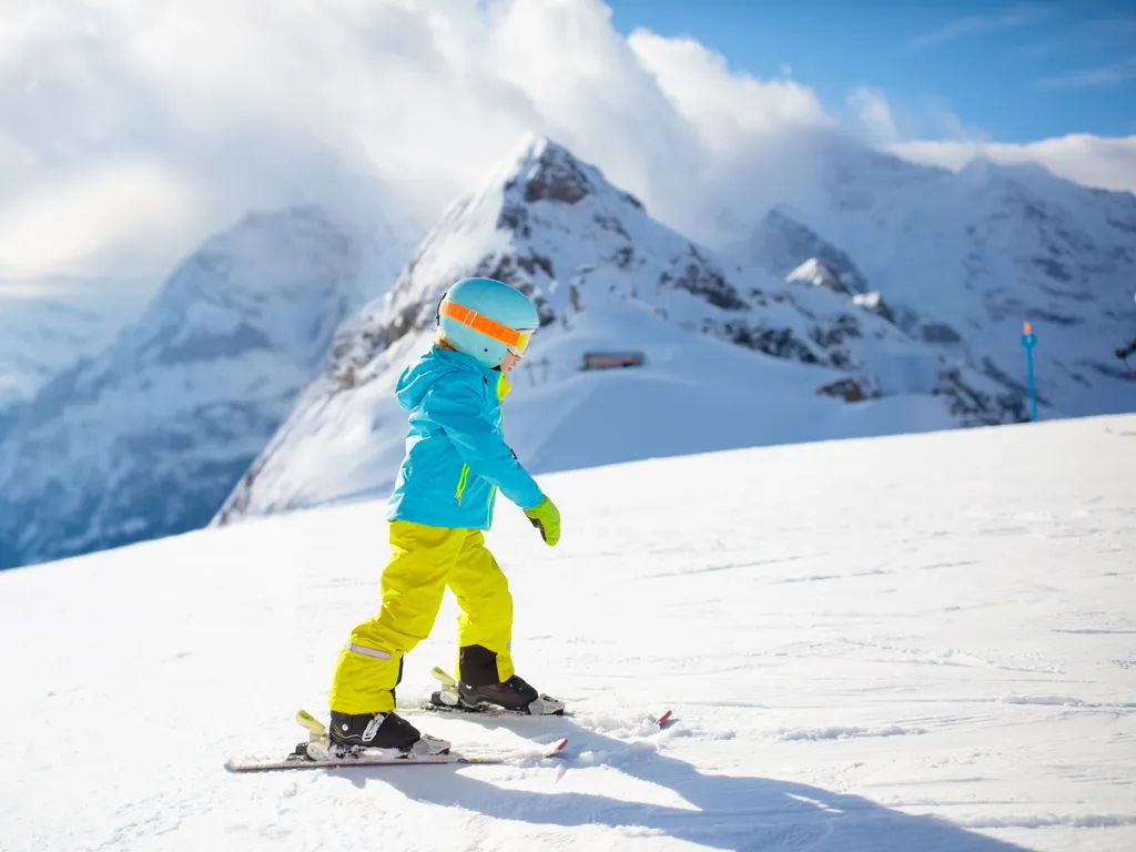 Child skiing in the mountains