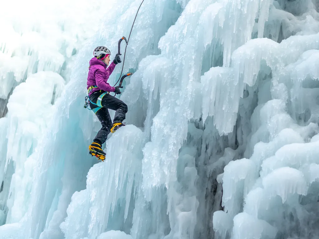Woman ice climbing